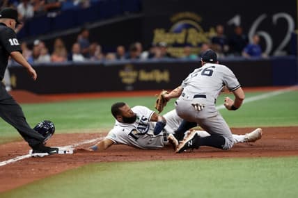 May 6, 2023; St. Petersburg, Florida, USA; Tampa Bay Rays center fielder Manuel Margot (13) is tagged out by New York Yankees second baseman Gleyber Torres (25) during the sixth inning at Tropicana Field. Mandatory Credit: Kim Klement-USA TODAY Sports