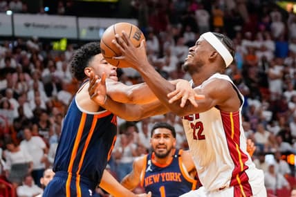 May 6, 2023; Miami, Florida, USA; New York Knicks guard Quentin Grimes (6) fouls Miami Heat forward Jimmy Butler (22) during the second half of game three of the 2023 NBA playoffs at Kaseya Center. Mandatory Credit: Rich Storry-USA TODAY Sports