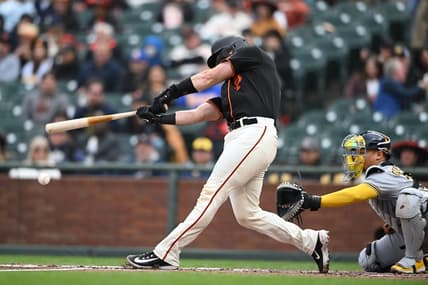 May 6, 2023; San Francisco, California, USA; San Francisco Giants catcher Joey Bart (21) hits an RBI double against the Milwaukee Brewers during the second inning at Oracle Park. Mandatory Credit: Robert Edwards-USA TODAY Sports