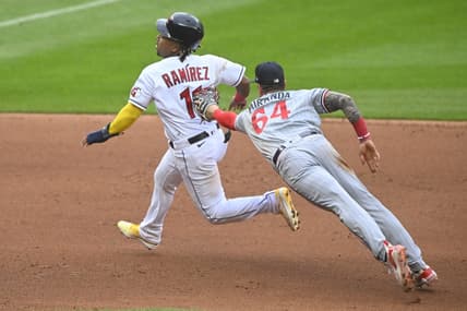 May 6, 2023; Cleveland, Ohio, USA; Cleveland Guardians third baseman Jose Ramirez (11) eludes a tag attempt by Minnesota Twins third baseman Jose Miranda (64) in the fourth inning at Progressive Field. Mandatory Credit: David Richard-USA TODAY Sports