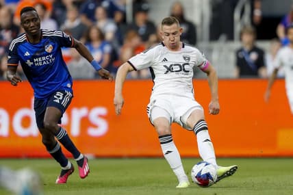 May 6, 2023; Cincinnati, Ohio, USA; D.C. United midfielder Russell Canouse (6) dribbles against FC Cincinnati midfielder Obinna Nwobodo (5) in the first half at TQL Stadium. Mandatory Credit: Katie Stratman-USA TODAY Sports