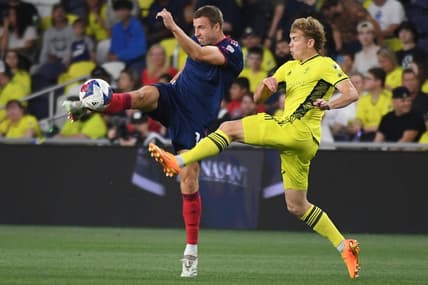 May 6, 2023; Nashville, Tennessee, USA; Chicago Fire defender Wyatt Omsberg (16) and Nashville SC forward Jacob Shaffelburg (14) in action during the first half at Geodis Park. Mandatory Credit: Christopher Hanewinckel-USA TODAY Sports