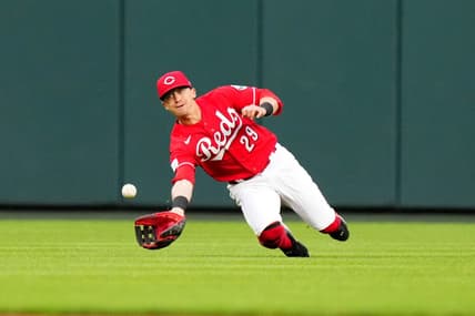 Cincinnati Reds center fielder TJ Friedl (29) completes a diving catch in the fifth inning during a baseball game between the Chicago White Sox and the Cincinnati Reds, Saturday, May 6, 2023, at Great American Ball Park in Cincinnati.
