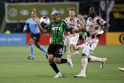 May 6, 2023; Portland, Oregon, USA; Austin FC midfielder Daniel Pereira (6) controls the ball against Portland Timbers forward Franck Boli (7, right) during the first half at Providence Park. Mandatory Credit: Soobum Im-USA TODAY Sports