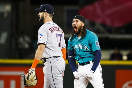 May 6, 2023; Seattle, Washington, USA; Seattle Mariners shortstop J.P. Crawford (3) reacts after hitting a three-run double against the Houston Astros during the eighth inning at T-Mobile Park. Houston Astros first baseman David Hensley (17) stands at left. Mandatory Credit: Joe Nicholson-USA TODAY Sports