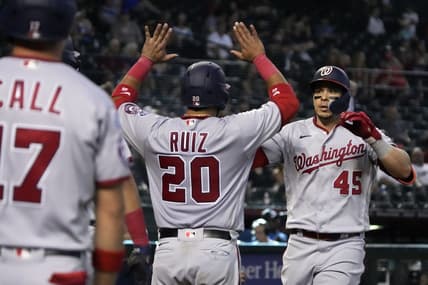May 7, 2023; Phoenix, Arizona, USA; Washington Nationals designated hitter Joey Meneses (45) celebrates with catcher Keibert Ruiz (20) and left fielder Alex Call (17) hitting a three run home run against the Arizona Diamondbacks in the ninth inning at Chase Field. Mandatory Credit: Rick Scuteri-USA TODAY Sports