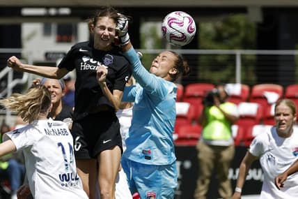 May 6, 2023; Washington, District of Columbia, USA; Washington Spirit midfielder Paige Metayer (26)  scores a goal on San Diego Wave FC goalkeeper Kailen Sheridan (1) at Audi Field. Mandatory Credit: Geoff Burke-USA TODAY Sports