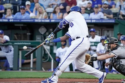 May 8, 2023; Kansas City, Missouri, USA; Kansas City Royals catcher Salvador Perez (13) hits a one run sacrifice fly against the Chicago White Sox in the first inning at Kauffman Stadium. Mandatory Credit: Denny Medley-USA TODAY Sports