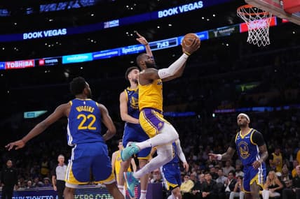 May 8, 2023; Los Angeles, California, USA; Los Angeles Lakers forward LeBron James (6) shoots the ball against Golden State Warriors forward Andrew Wiggins (22) and guard Klay Thompson (11) during game four of the 2023 NBA playoffs at Crypto.com Arena. Mandatory Credit: Kirby Lee-USA TODAY Sports