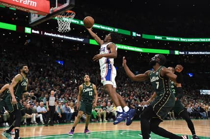 May 9, 2023; Boston, Massachusetts, USA; Philadelphia 76ers guard Tyrese Maxey (0) lays the ball in the basket past Boston Celtics guard Jaylen Brown (7) in the first half during game five of the 2023 NBA playoffs at TD Garden. Mandatory Credit: Bob DeChiara-USA TODAY Sports