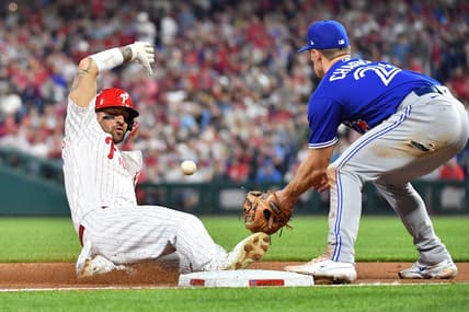 May 9, 2023; Philadelphia, Pennsylvania, USA; Philadelphia Phillies right fielder Nick Castellanos (8) sides safely into third base ahead of tag by Toronto Blue Jays third baseman Matt Chapman (26) during the sixth inning at Citizens Bank Park. Mandatory Credit: Eric Hartline-USA TODAY Sports