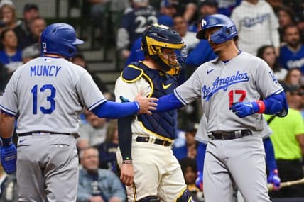 May 9, 2023; Milwaukee, Wisconsin, USA;  Los Angeles Dodgers second baseman Miguel Vargas (17) celebrates with third baseman Max Muncy (13) after hitting a two run home run as Milwaukee Brewers catcher Victor Caratini (7) looks on in the sixth inning at American Family Field. Mandatory Credit: Benny Sieu-USA TODAY Sports