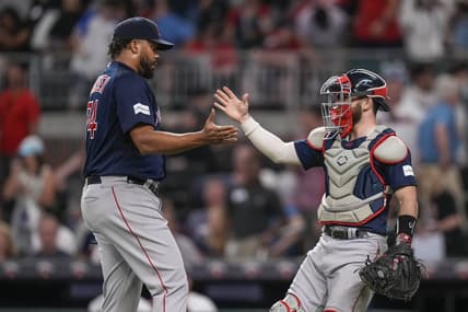 May 10, 2023; Cumberland, Georgia, USA; Boston Red Sox relief pitcher Kenley Jansen (74) reacts with catcher Connor Wong (12) after recording his 400th career save against the Atlanta Braves at Truist Park. Mandatory Credit: Dale Zanine-USA TODAY Sports