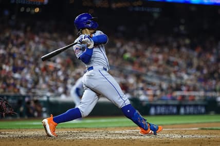 May 12, 2023; Washington, District of Columbia, USA; New York Mets shortstop Francisco Lindor (12) hits a three run single against the Washington Nationals during the sixth inning at Nationals Park. Mandatory Credit: Scott Taetsch-USA TODAY Sports