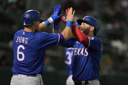 May 12, 2023; Oakland, California, USA; Texas Rangers right fielder Robbie Grossman (right) celebrates with third baseman Josh Jung (6) after hitting a home run against the Oakland Athletics during the sixth inning at Oakland-Alameda County Coliseum. Mandatory Credit: Darren Yamashita-USA TODAY Sports