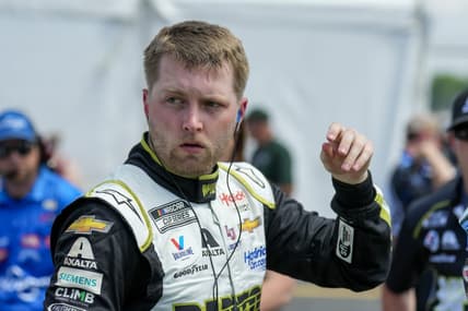 May 13, 2023; Darlington, South Carolina, USA; William Byron exits his car after a qualifying lap at Darlington Raceway. Mandatory Credit: David Yeazell-USA TODAY Sports