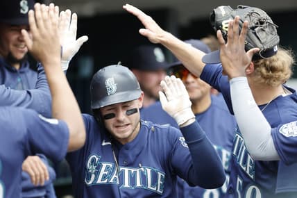 May 13, 2023; Detroit, Michigan, USA;  Seattle Mariners left fielder Jarred Kelenic (10) is congratulated by teammates after hitting a two-run home run in the third inning against the Detroit Tigers at Comerica Park. Mandatory Credit: Rick Osentoski-USA TODAY Sports
