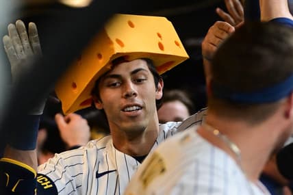 May 13, 2023; Milwaukee, Wisconsin, USA; Milwaukee Brewers left fielder Christian Yelich (22) celebrates in the dugout after hitting a 2-run home run in the third inning against the Kansas City Royals at American Family Field. Mandatory Credit: Benny Sieu-USA TODAY Sports