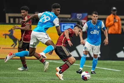 May 13, 2023; Atlanta, Georgia, USA; Atlanta United midfielder Thiago Almada (23) controls the ball in front of Charlotte FC defender Adilson Malanda (29) during the first half at Mercedes-Benz Stadium. Mandatory Credit: Dale Zanine-USA TODAY Sports