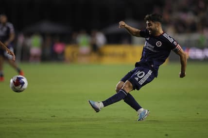 May 13, 2023; Fort Lauderdale, Florida, USA; New England Revolution midfielder Carles Gil (10) passes the ball during the game at DRV PNK Stadium. Mandatory Credit: Sam Navarro-USA TODAY Sports
