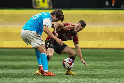 May 13, 2023; Atlanta, Georgia, USA; Charlotte FC defender midfielder Benjamin Bender (15)  and Atlanta United defender Brooks Lennon (11) fight for the ball at Mercedes-Benz Stadium. Mandatory Credit: Dale Zanine-USA TODAY Sports
