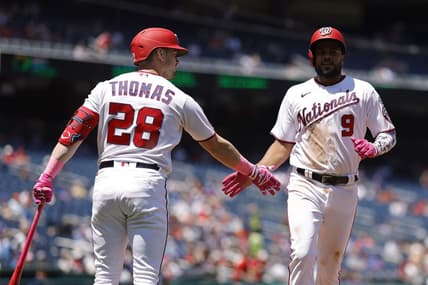 May 14, 2023; Washington, District of Columbia, USA;Washington Nationals third baseman Jeimer Candelario (9) celebrates with Nationals right fielder Lane Thomas (28) after scoring a run on an RBI single by Nationals shortstop CJ Abrams (not pictured) against the New York Mets during the fourth inning of the continuation of a suspended game at Nationals Park. Mandatory Credit: Geoff Burke-USA TODAY Sports