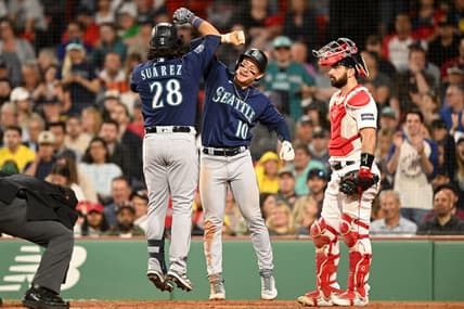 May 15, 2023; Boston, Massachusetts, USA; Seattle Mariners third baseman Eugenio Suarez (28) celebrates with left fielder Jarred Kelenic (10) after hitting a two-run home run against the Boston Red Sox during the eighth inning at Fenway Park. Mandatory Credit: Brian Fluharty-USA TODAY Sports