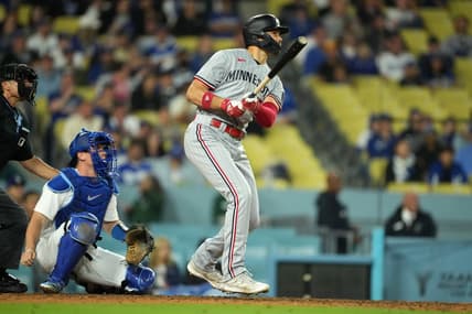 May 15, 2023; Los Angeles, California, USA; Minnesota Twins right fielder Trevor Larnach (9) follows through on a three-run home run in the eighth inning as Los Angeles Dodgers catcher Will Smith (16) reacts at Dodger Stadium. Mandatory Credit: Kirby Lee-USA TODAY Sports