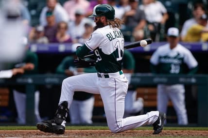May 17, 2023; Denver, Colorado, USA; Colorado Rockies designated hitter Charlie Blackmon (19) drops to the ground after a foul tip in the fifth inning against the Cincinnati Reds at Coors Field. Mandatory Credit: Isaiah J. Downing-USA TODAY Sports