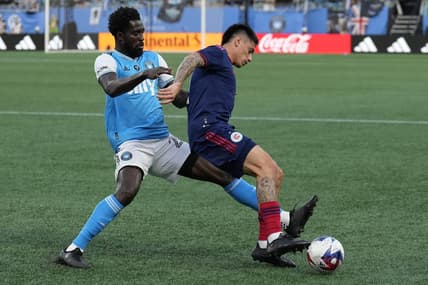 May 17, 2023; Charlotte, North Carolina, USA; Charlotte FC midfielder Derrick Jones (20) and Chicago Fire defender Alonso Aceves (3) vie for the possession during the first half at Bank of America Stadium. Mandatory Credit: Jim Dedmon-USA TODAY Sports