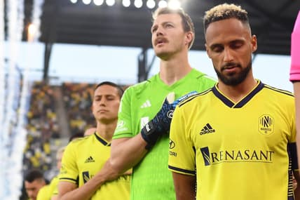 May 17, 2023; Nashville, Tennessee, USA; Nashville SC goalkeeper Joe Willis (1) and Nashville SC midfielder Hany Mukhtar (10) walk out to the pitch for the line up prior to the game at Geodis Park. Mandatory Credit: Christopher Hanewinckel-USA TODAY Sports