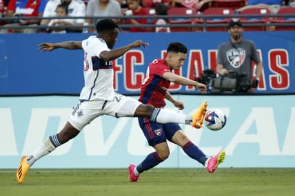 May 17, 2023; Frisco, Texas, USA; Vancouver Whitecaps midfielder Jean-Claude Ngando (26) defends against FC Dallas forward Alan Velasco (20) in the first half at Toyota Stadium. Mandatory Credit: Tim Heitman-USA TODAY Sports