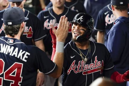 May 17, 2023; Arlington, Texas, USA; Atlanta Braves shortstop Orlando Arcia (11) is greeted in the dugout after hitting a go ahead solo home run against the Texas Rangers during the ninth inning at Globe Life Field. Mandatory Credit: Raymond Carlin III-USA TODAY Sports