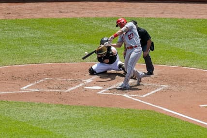 May 18, 2023; Baltimore, Maryland, USA;  Los Angeles Angels center fielder Mike Trout (27) hits a solo home run to center field during the third inning against the Baltimore Orioles at Oriole Park at Camden Yards. Mandatory Credit: Tommy Gilligan-USA TODAY Sports