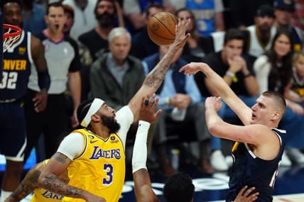 May 18, 2023; Denver, Colorado, USA; Denver Nuggets center Nikola Jokic (15) shoots against Los Angeles Lakers forward Anthony Davis (3) in the first half during game two of the Western Conference Finals for the 2023 NBA playoffs at Ball Arena. Mandatory Credit: Ron Chenoy-USA TODAY Sports