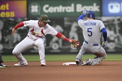 May 19, 2023; St. Louis, Missouri, USA; Los Angeles Dodgers first baseman Freddie Freeman (5) is safe at second base ahead of the tag from St. Louis Cardinals second baseman Nolan Gorman (16) in the first inning at Busch Stadium. Mandatory Credit: Joe Puetz-USA TODAY Sports