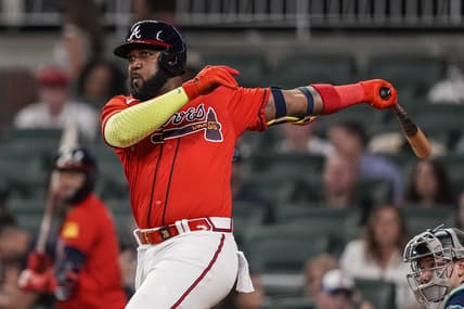 May 19, 2023; Cumberland, Georgia, USA; Atlanta Braves designated hitter Marcell Ozuna (20) singles driving in two runs against the Seattle Mariners during the eighth inning at Truist Park. Mandatory Credit: Dale Zanine-USA TODAY Sports