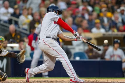 May 19, 2023; San Diego, California, USA;  Boston Red Sox third baseman Rafael Devers (11) hits a three run home run (2) in the third inning against the San Diego Padres at Petco Park. Mandatory Credit: David Frerker-USA TODAY Sports