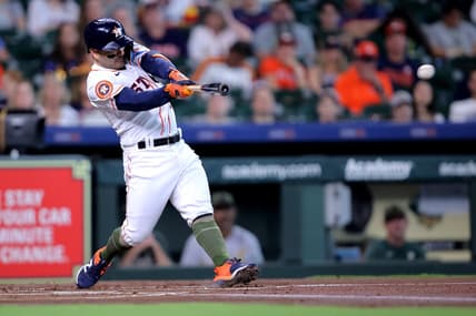 May 20, 2023; Houston, Texas, USA; Houston Astros second baseman Jose Altuve (27) hits a double against the Oakland Athletics during the first inning at Minute Maid Park. Mandatory Credit: Erik Williams-USA TODAY Sports