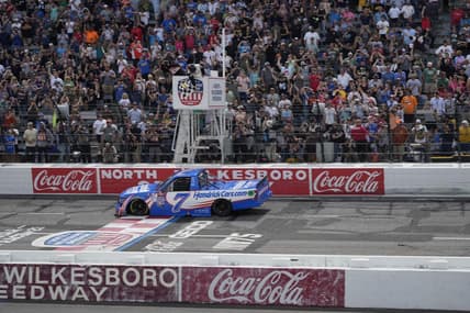May 20, 2023; North Wilkesboro, North Carolina, USA;  NASCAR Craftsman Truck Series driver Kyle Larson (7) crosses the finish line during the Tyson 250 at North Wilkesboro Speedway. Mandatory Credit: Jim Dedmon-USA TODAY Sports