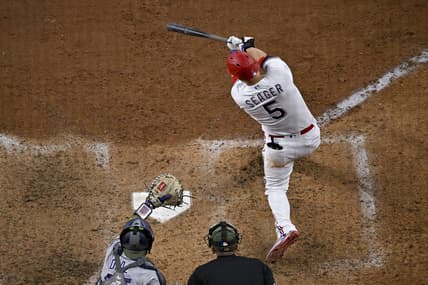 May 20, 2023; Arlington, Texas, USA; Texas Rangers shortstop Corey Seager (5) hits a home run and drives in two runs against the Colorado Rockies during the sixth inning at Globe Life Field. Mandatory Credit: Jerome Miron-USA TODAY Sports