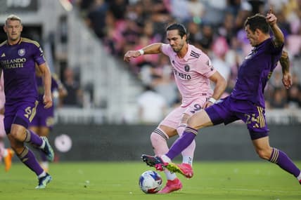 May 20, 2023; Fort Lauderdale, Florida, USA; Orlando City defender Kyle Smith (24) and Inter Miami CF forward Leonardo Campana (9) battle for possession during the first half at DRV PNK Stadium. Mandatory Credit: Sam Navarro-USA TODAY Sports