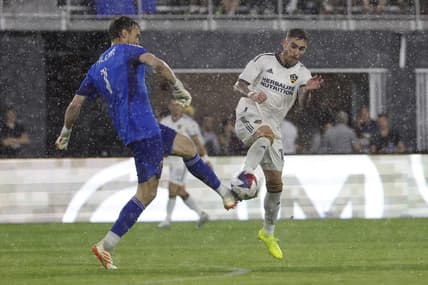 May 20, 2023; Washington, District of Columbia, USA; D.C. United goalkeeper Tyler Miller (1) clears the ball from LA Galaxy midfielder Tyler Boyd (11) in the first half at Audi Field. Mandatory Credit: Geoff Burke-USA TODAY Sports
