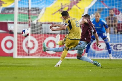 May 20, 2023; Commerce City, Colorado, USA; Real Salt Lake midfielder Damir Kreilach (8) takes a shot at goal against Colorado Rapids defender Danny Wilson (4) during the first half at Dick's Sporting Goods Park. Mandatory Credit: Ron Chenoy-USA TODAY Sports