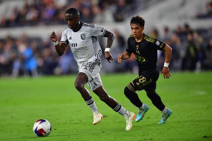 May 20, 2023; Los Angeles, California, USA; San Jose Earthquakes midfielder Jamiro Monteiro (35) controls the ball against Los Angeles FC defender Erik Duenas (18) during the first half at BMO Stadium. Mandatory Credit: Gary A. Vasquez-USA TODAY Sports