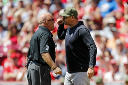 May 21, 2023; Cincinnati, Ohio, USA; New York Yankees manager Aaron Boone (17) argues with umpire Brian O'Nora (7) before being ejected after a play against the Cincinnati Reds in the first inning at Great American Ball Park. Mandatory Credit: Katie Stratman-USA TODAY Sports