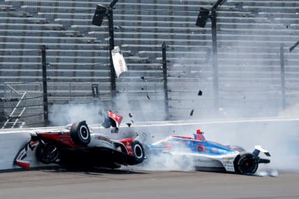 Rahal Letterman Lanigan Racing driver Katherine Legge (44) and Dreyer & Reinbold Racing driver Stefan Wilson (24) crash in the first turn Monday, May 22, 2023, during practice ahead of the 107th running of the Indianapolis 500 at Indianapolis Motor Speedway.