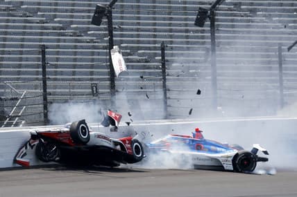 May 22, 2023; Speedway, Indiana, USA;Rahal Letterman Lanigan Racing driver Katherine Legge (44) and Dreyer & Reinbold Racing driver Stefan Wilson (24) crash in the first turn Monday, May 22, 2023, during practice ahead of the 107th running of the Indianapolis 500 at Indianapolis Motor Speedway. Mandatory Credit: John Chilton-USA TODAY Sports