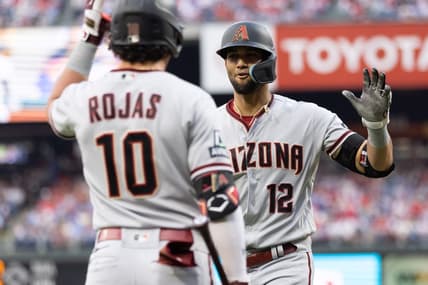 May 22, 2023; Philadelphia, Pennsylvania, USA; Arizona Diamondbacks left fielder Lourdes Gurriel Jr. (12) celebrates with third baseman Josh Rojas (10) after hitting a home run during the second inning against the Philadelphia Phillies at Citizens Bank Park. Mandatory Credit: Bill Streicher-USA TODAY Sports