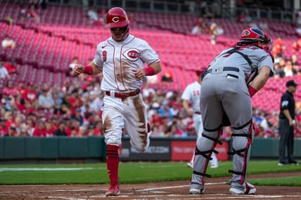 Cincinnati Reds shortstop Matt McLain (9) scores on a Tyler Stephenson single in the first inning of the MLB National League game between the Cincinnati Reds and the St. Louis Cardinals at Great American Ball Park in downtown Cincinnati on Monday, May 22, 2023. The Reds led 4-3 after three innings.